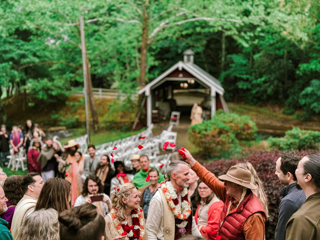 Gathering in front of the bridge for exchanging vows nontraditional wedding ceremony pagan ceremony