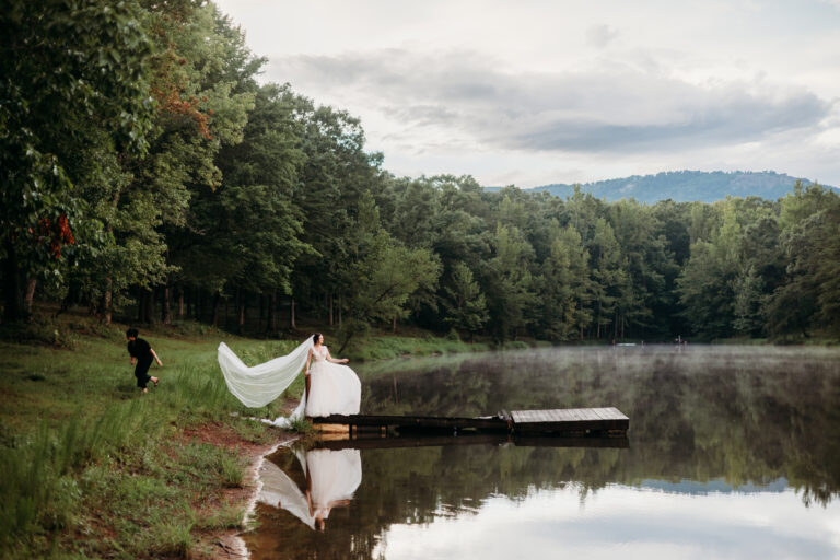 A bride poses for pictures on a Dock and an outdoor wedding venue with a pond