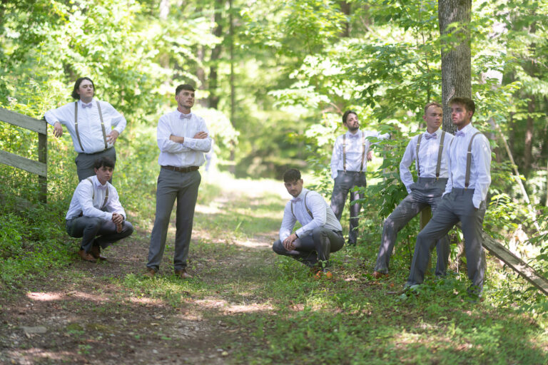 Groom and groomsmen in the woods by the river had an outdoor wedding venue near Greenville South Carolina