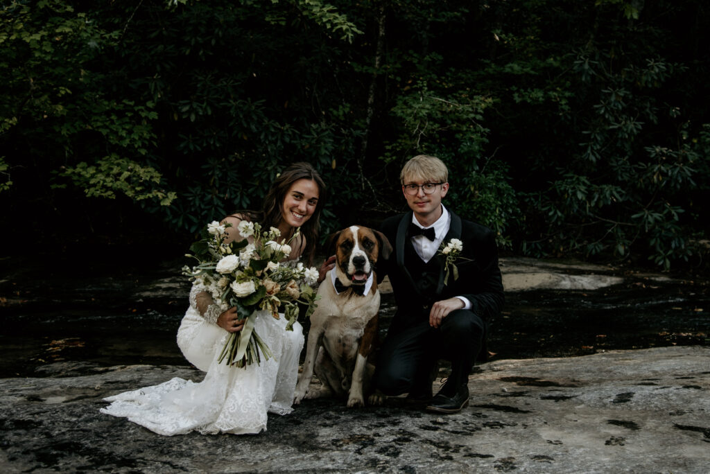  A bride and groom with their dog at a pet friendly wedding venue upstate South Carolina