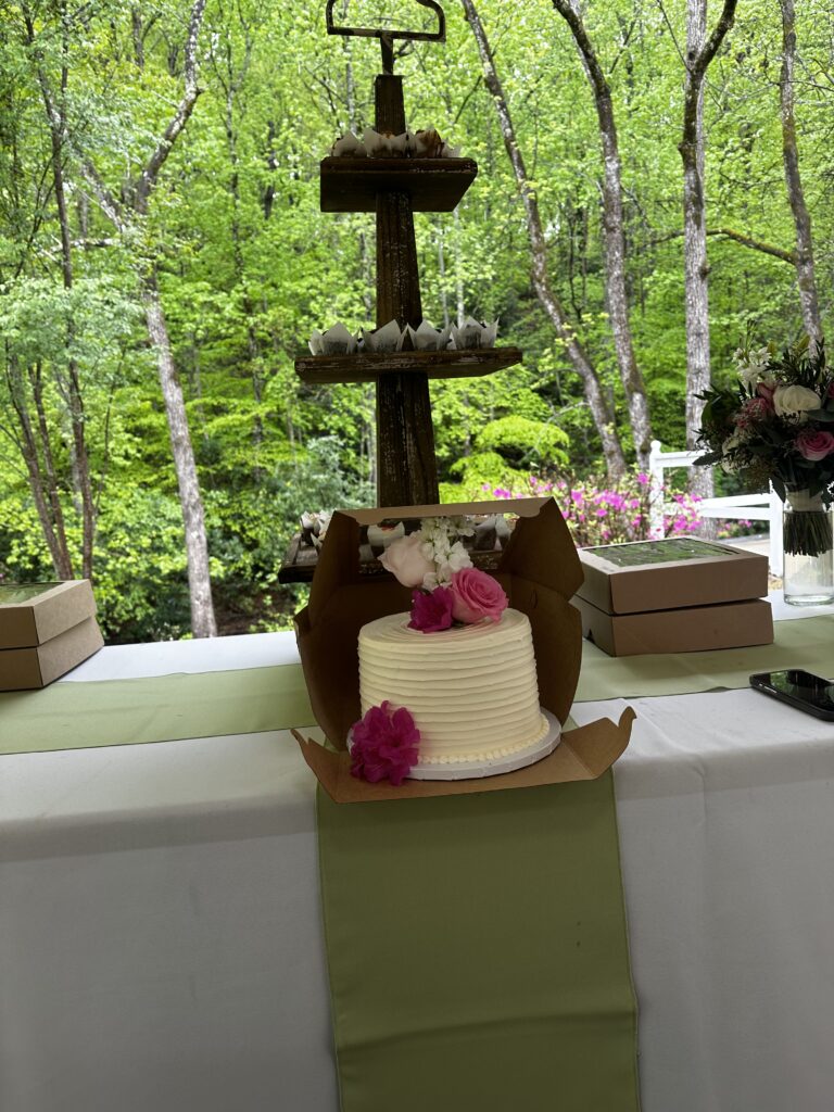 A small wedding cake with florals from Inn Season at The Venue at Ballenger Bridge