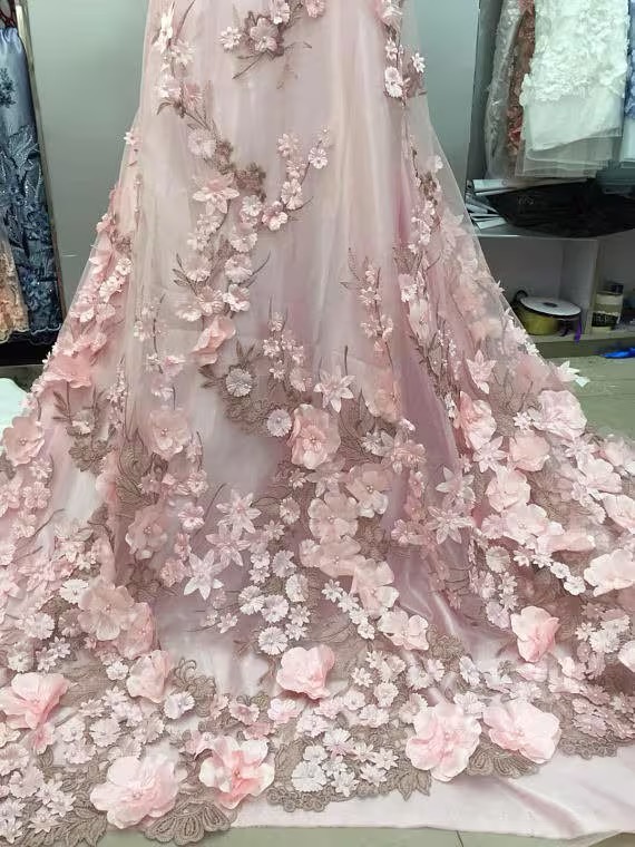 Pink wedding gown with 3-D floral embellishment 2025 trending wedding gown style