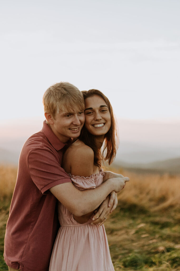  A newly engaged couple celebrate at the top of the mountains and South Carolina wedding venue