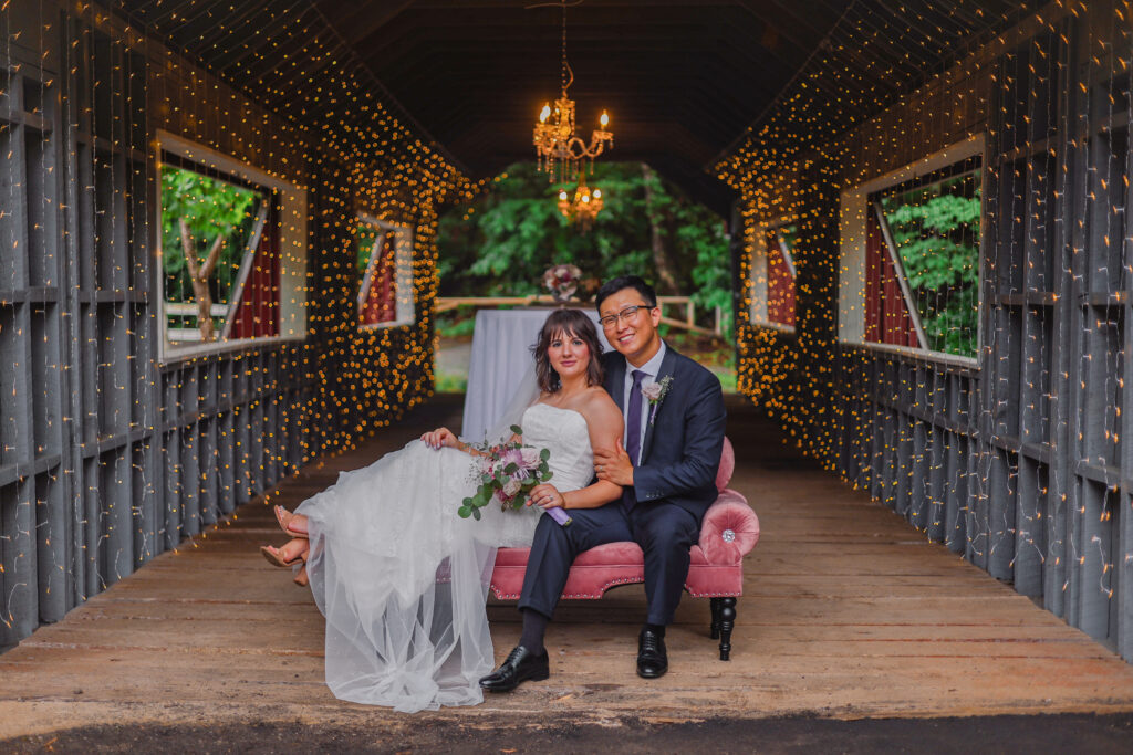 Greenville SC wedding venue - Ballenger Bridge a couple lounges on a couch at school wedding venue
