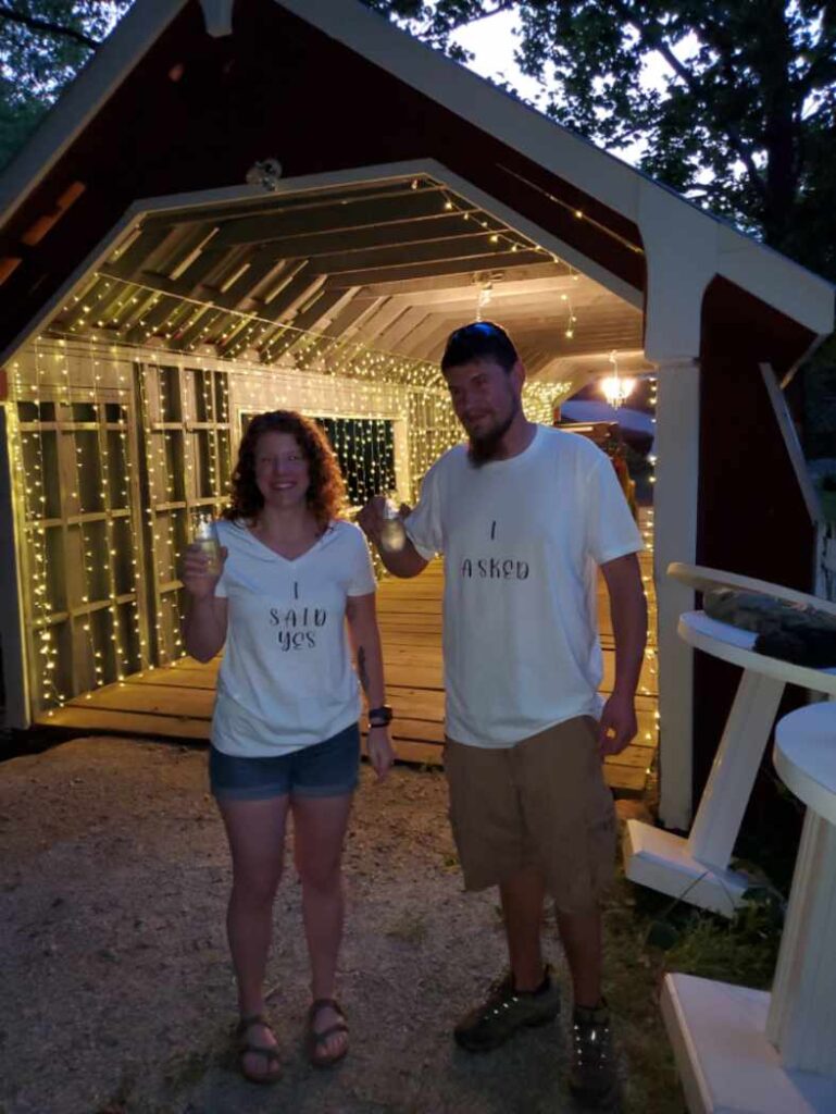 Newly engaged a couple celebrates their engagement with a toast at The Venue at Ballenger Bridge Greenville wedding venue