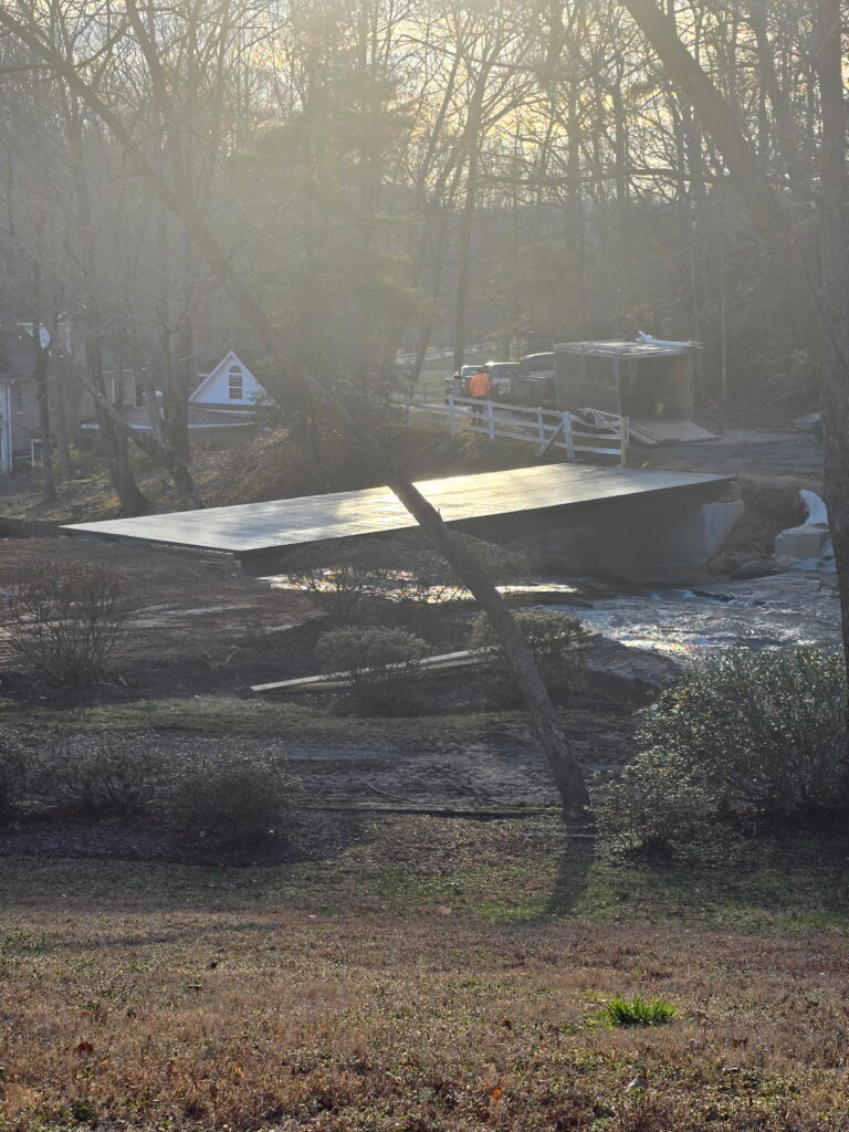 Fresh concrete reflects the sunlight across the middle tiger river