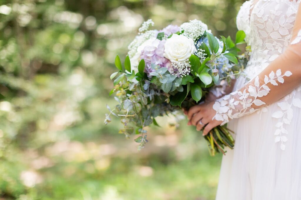 Bride holding luxury flowers at her garden wedding venue near Greenville SC