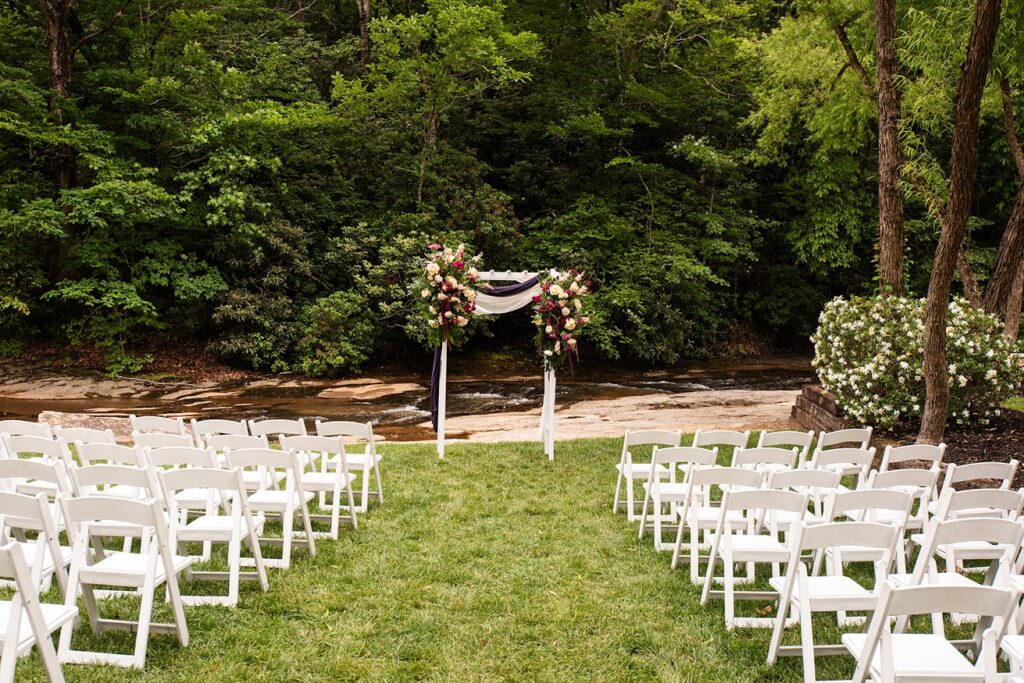 SarahMatt-44 - Ballenger Bridge Wedding ceremony by the river with forest and green landscapes