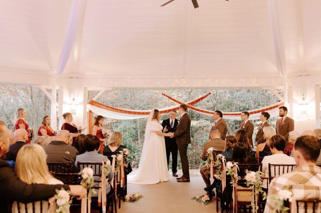 Our beautiful bride & groom exchanging vows at their garden pavilion wedding ceremony near Greenville SC.